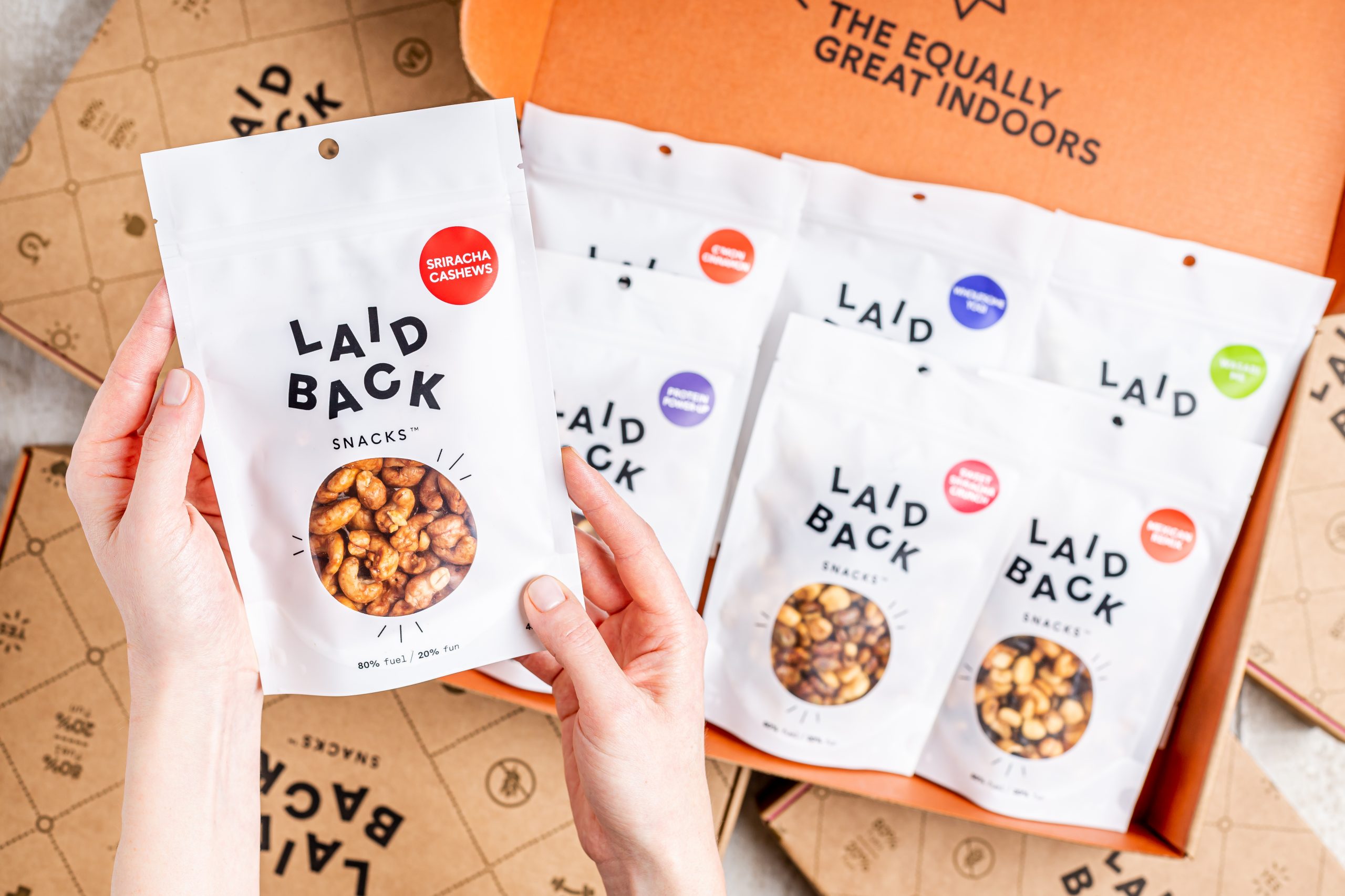 A person holding Laid Back Snacks bag